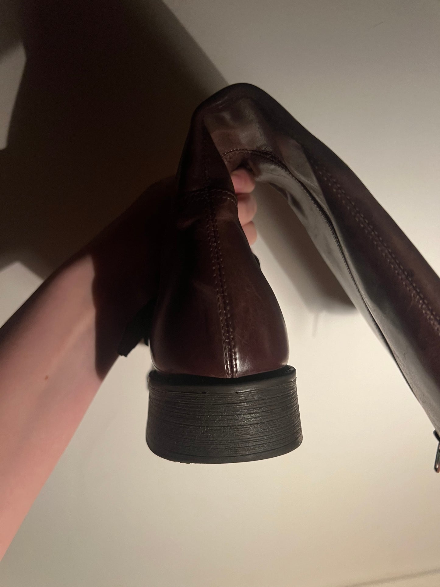 Brown leather boots with metal buckles