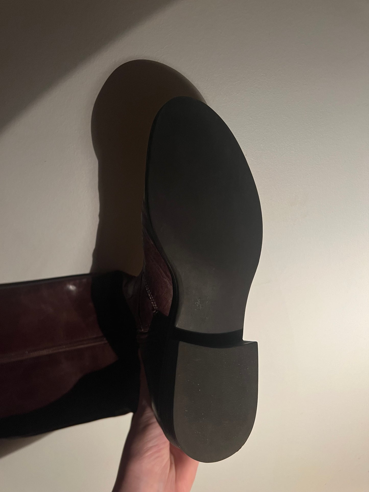 Brown leather boots with metal buckles