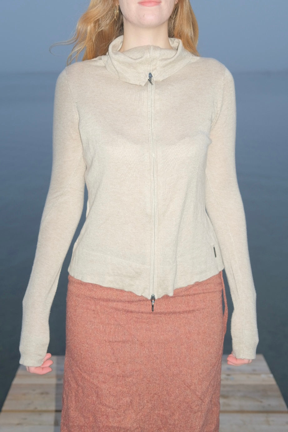 Cream-colored wool and silk knit sweater