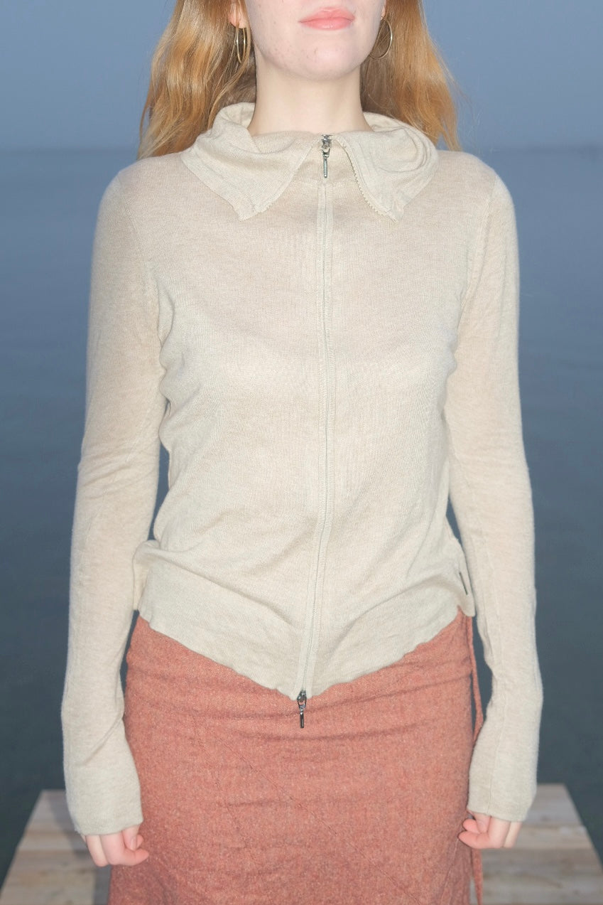 Cream-colored wool and silk knit sweater